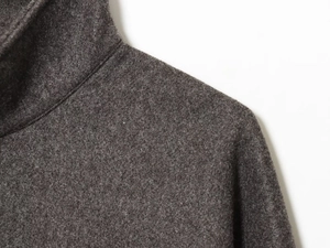 Close-up of the premium dark grey wool blend texture on the bomber jacket shoulder