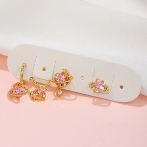 Pink heart planet earring set with gold finish and sparkling zirconia on jewelry card