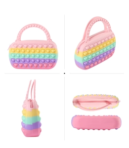 Detailed views of a rainbow heart-shaped pop-it fidget handbag made of soft silicone