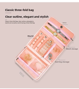 Three-fold pink PU leather jewelry organizer with slots for rings, earrings and watches