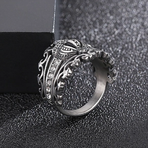 Macro detail of gothic crown ring with vintage silver texture and pave zircon inlay