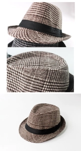 Detailed views of brown checkered straw jazz hat with black decorative ribbon band