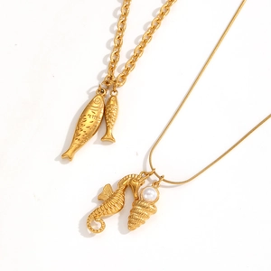 Golden ocean theme necklace set with seahorse and shell pendants and pearls
