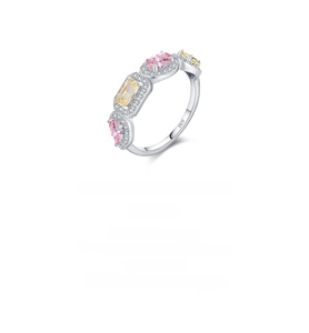 Detail of S925 silver ring featuring pink and yellow crystals with pave diamond accents