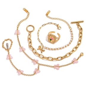 5-piece gold jewelry set featuring pink butterfly chains and a palm tree signet ring