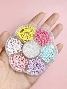 Handheld flower-shaped box with 7 compartments of colorful mini bows and pearls for nail art