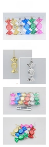 Detail of 6-piece colorful Christmas candy ornaments with glitter swirl patterns and gold strings