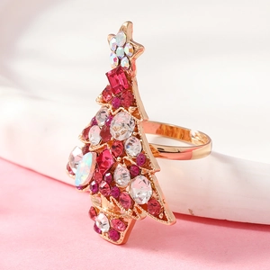 Macro shot of an adjustable Christmas tree ring with colorful rhinestones and gold plating