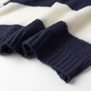 Close-up of soft navy and white striped knit fabric showing thick texture and weave