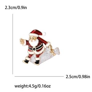 Enameled Santa Claus brooch pin with silver glitter gift bag details on white background
