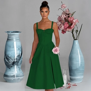 Detail of dark green midi dress featuring a ruched bodice and delicate bow tie strap