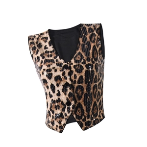 Detail of leopard print sequined vest featuring black buttons and shimmering texture