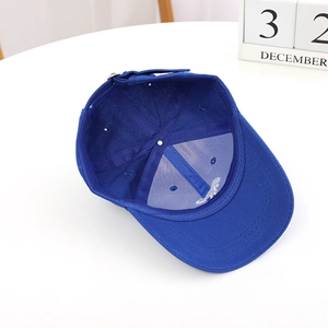 Royal blue kids dinosaur baseball cap showing interior structure and adjustable strap