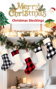 Close-up of five Christmas stockings in red and black buffalo plaid with hanging loops