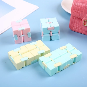 Fidget Infinity Cube sensory toys in pastel colors showing multiple folding positions