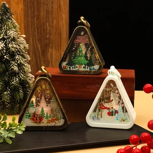 Retro Christmas lantern trio with Santa and snowman patterns, warm glowing festive decor