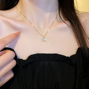 Titanium steel minimalist heart pendant necklace in gold finish with sparkling crystals