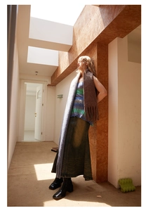 Detail of soft 20% wool gradient scarf paired with striped vest and denim skirt