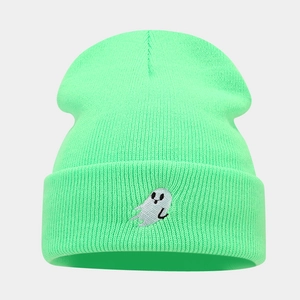 Detail of mint green ribbed knit beanie with white cartoon ghost embroidery on the cuff