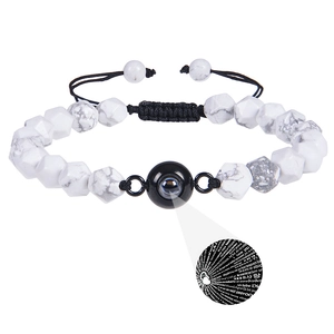 Detailed view of beaded bracelet with stone texture and I Love You projection stone