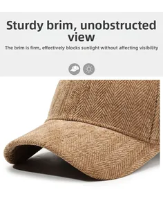 Close-up of brown herringbone fabric and high-quality stitching on a thick baseball cap