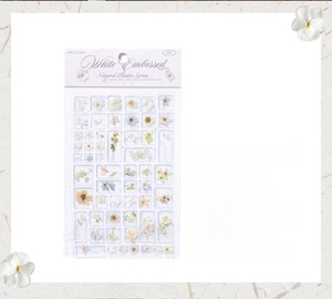 Detailed macro view of 3D embossed white floral acrylic stickers for DIY crafts