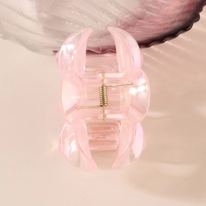 Pink hollow flower hair claw clip with rainbow iridescent finish for elegant hair styling