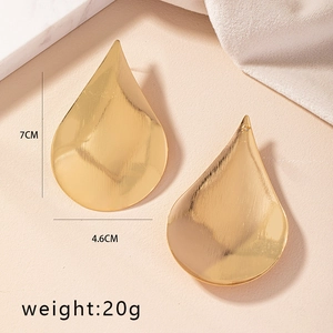 Detailed size view of large gold teardrop earrings measuring 7cm by 4.6cm