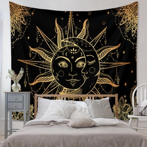 Detailed view of large black and gold sun-moon tapestry as a bohemian bedroom wall decor