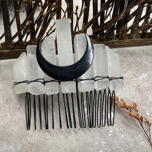 Detail of natural crystal shards and black crescent moon on handmade bridal hair comb