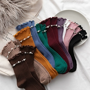 Set of colorful cotton crew socks with ruffled edges and pearl rivet decorations