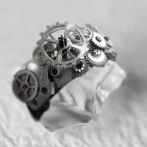 Macro shot of steampunk mechanical gear ring in vintage silver finish on crystal base
