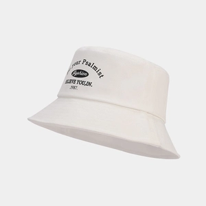 Detail of creative lettering print on white cotton bucket hat with clean stitching