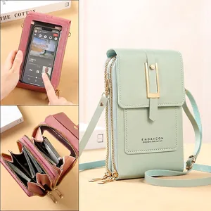 Minimalist touchscreen phone crossbody bag with transparent window and multi-zip compartments