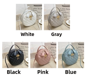 Quilted round crossbody bags in white, grey, black, pink, and blue with swan charms