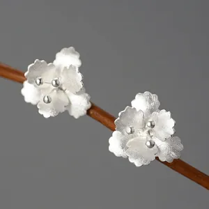 Exquisite 925 sterling silver begonia flower stud earrings with matte finish on wood branch