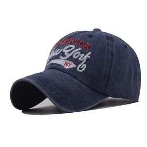 Detail of navy blue washed cotton baseball cap with New York and America embroidery