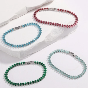 Dettaglio di quattro bracciali tennis con zirconi taglio marquise su base in pietra
