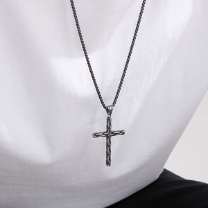 Men's hip hop stainless steel cross pendant necklace with black box chain on white shirt