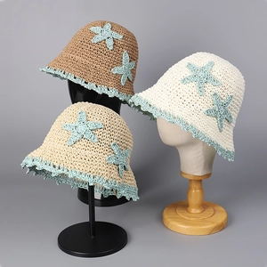 Handmade straw bucket hats with starfish embroidery and wavy trim for summer beach sun protection