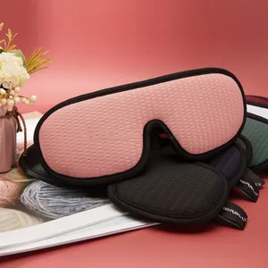 Detail showing breathable honeycomb mesh texture and pink fabric of the 3D sleep mask