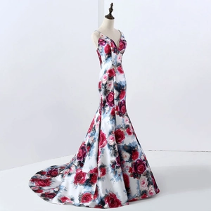 Detail view of floral mermaid evening gown with elegant rose print and sleek satin finish