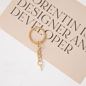 Detail of 25mm golden key ring with 5x10 eye pin screws for DIY jewelry making