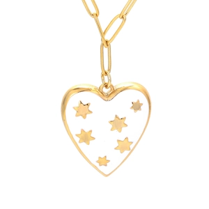 Close-up of heart-shaped necklace pendant with white enamel and golden star patterns