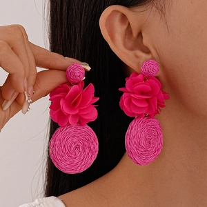 Bohemian rose red fabric flower and woven rattan drop earrings for a vacation style