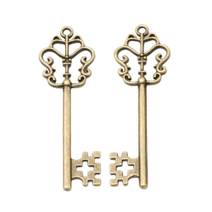 Vintage bronze alloy key pendants with aged metal texture on a clean white background