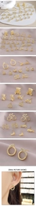 Close-up of gold-plated animal stud earrings with sparkling crystals and fine details