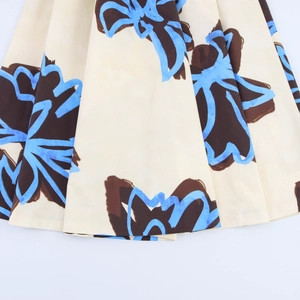 Close-up of elegant floral print on beige fabric with detailed abstract patterns and texture