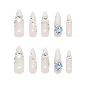 Uñas postizas de almendra hechas a mano con gemas azules y efecto ojo de gato brillante