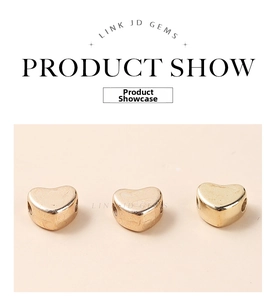 Detail view of heart-shaped gold-plated acrylic spacer beads for DIY jewelry making